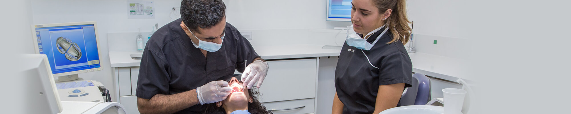 dentist and nurse working on a patient